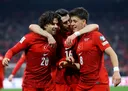 Türkiye edges Romania to move within one game of World Cup return