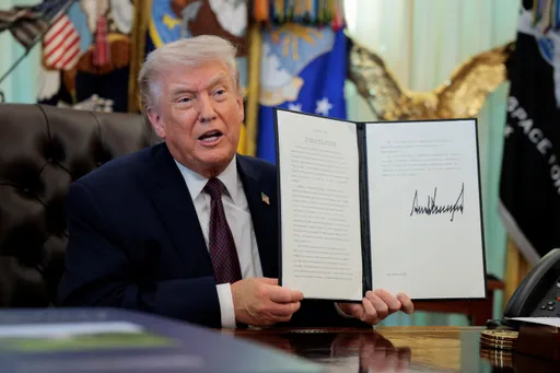 Trump signs executive order seeking to restrict mail-in voting