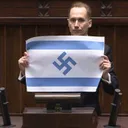 Polish lawmaker sparks controversy after displaying Israeli flag with Nazi swastika