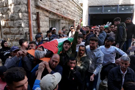 West Bank town grieves after child and man killed in Israeli settler attack