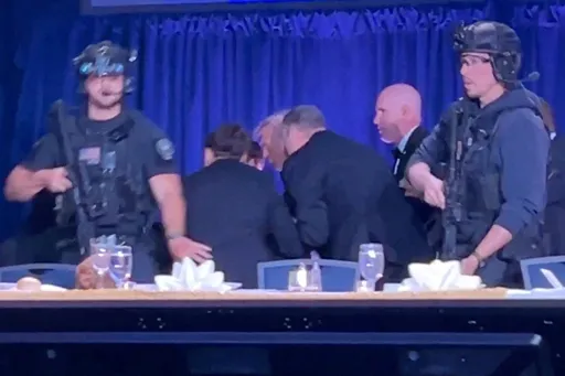 Trump evacuated from press dinner as 'loud bangs' spark security alert