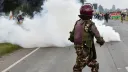 Kenya police use teargas to disperse anti-France protesters near summit co-hosted by Macron