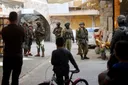 Israeli army shuts down charity in Nablus, conducts raids across occupied West Bank