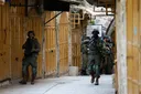 Israeli army raids occupied West Bank towns, forcing shop closures during Eid rush