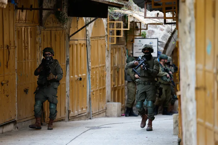 Israeli army raids occupied West Bank towns, forcing shop closures during Eid rush