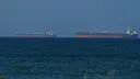 Iran says it struck US and Israeli-linked vessel after attack on Iranian ship