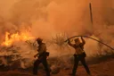 Colorado prison evacuated as growing wildfire becomes one of largest in state history