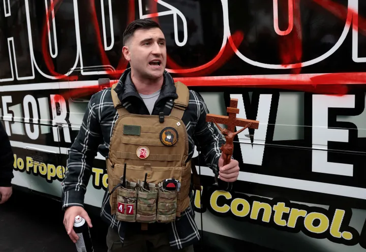 US Senate candidate tries to burn Quran copy at anti-Islam march in Michigan