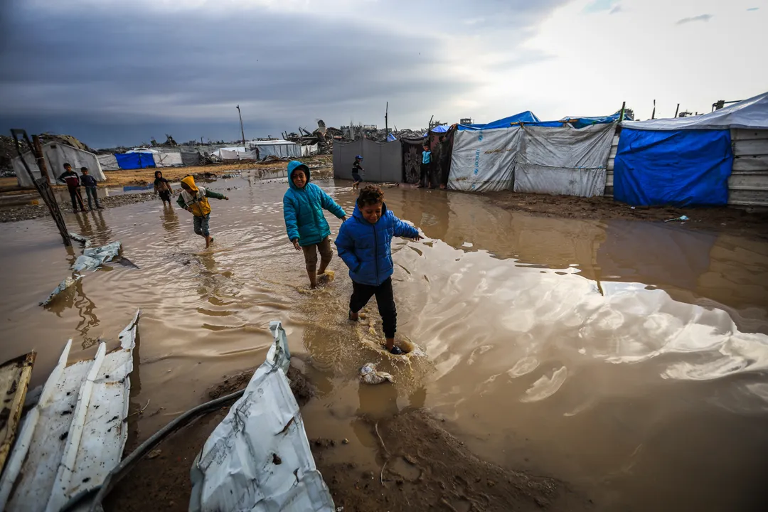 Heavy rains flood thousands of tents sheltering displaced Palestinians in Gaza