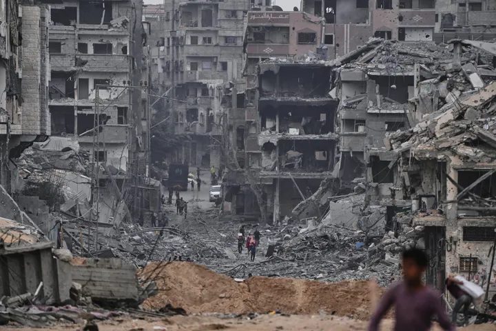 Two killed, five wounded as Israeli-damaged building collapses in Gaza camp