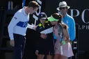 Türkiye's Zeynep Sonmez rushes to aid ballkid during Australian Open win