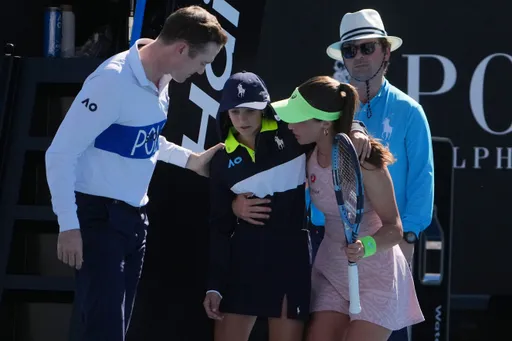 Türkiye's Zeynep Sonmez rushes to aid ballkid during Australian Open win