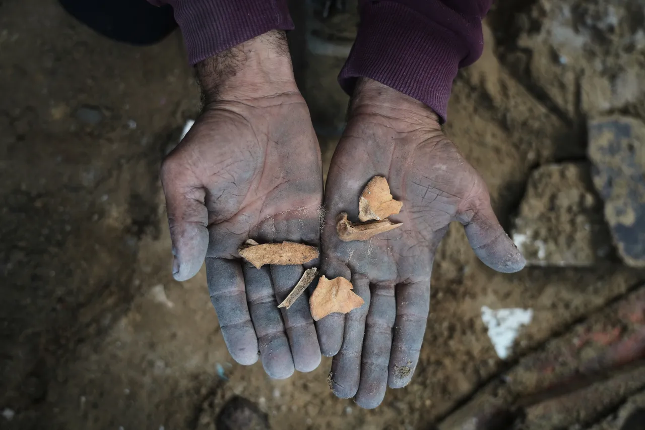 A father in Gaza searches rubble for his family's remains after Israeli air strike destroys home