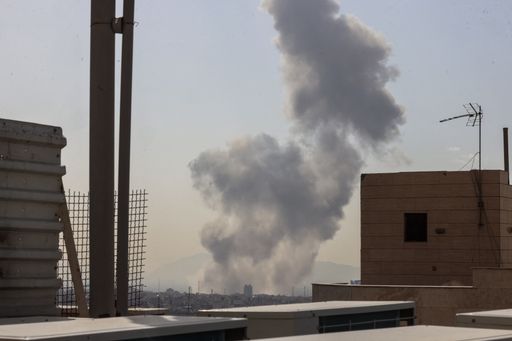 A plume of smoke rises following a reported explosion in Tehran on February 28, 2026.