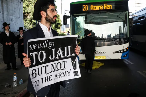 Haredi Jews protest arrests of draft evaders, storm military police chief's home in Israel