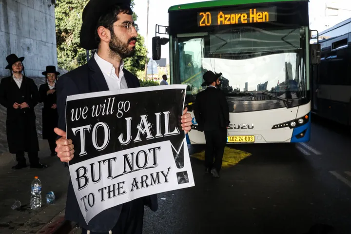 Haredi Jews protest arrests of draft evaders, storm military police chief's home in Israel