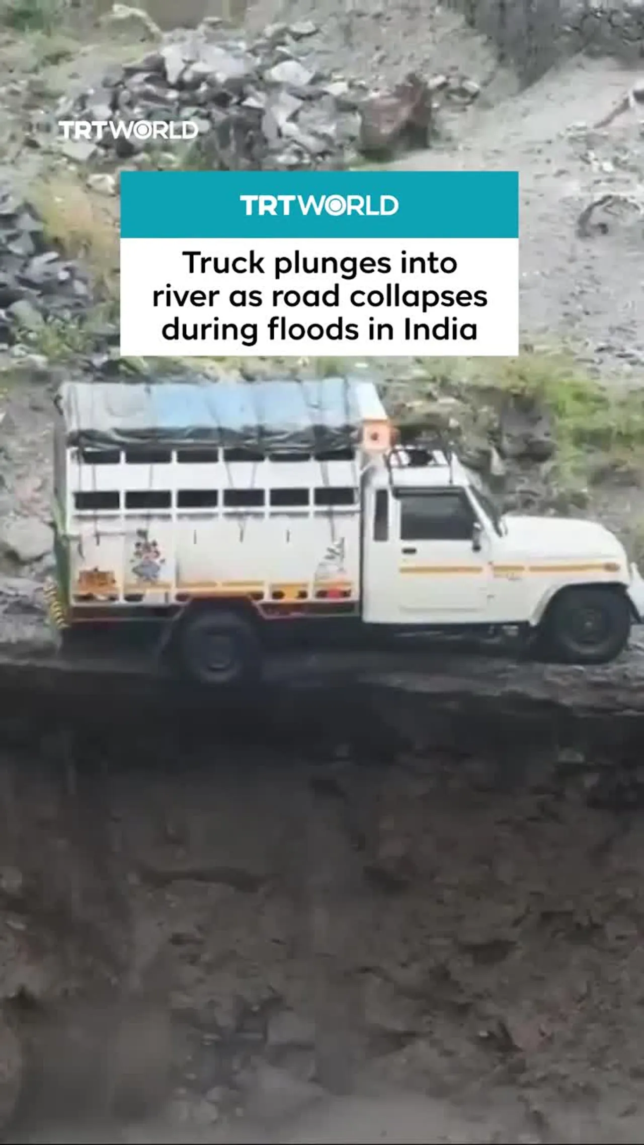Truck plunges into river as road collapses during floods in India